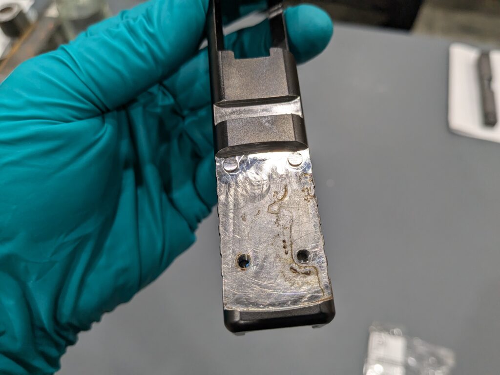 Uncoated slide returned for refinishing, showing early rust